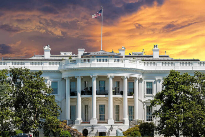 shutterstock_382759309 The White House with vibrant sunset sky.