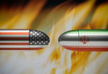 Iran Strikes, Americans Killed — Now What? Bullets painted with U.S. and Iran flags face each other amid flames