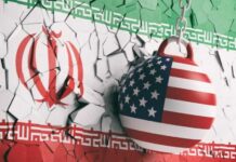 NEWS ALERT: Missile Standoff – Trump Dares Tehran A wrecking ball painted with the American flag is breaking through a wall featuring the Iranian flag