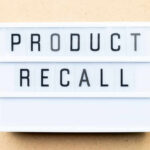 Shattering Grills Spark $500 Payouts Lightbox sign with the words product recall on a beige background