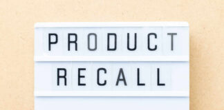 Lightbox sign with the words product recall on a beige background