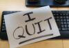 Unemployment Dips, Because Workers Quit! A resignation letter reading 'I QUIT' placed on a keyboard