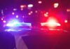 Chimney Horror Inside School Police car with flashing red and blue lights at night