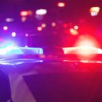 Chimney Horror Inside School Police car with flashing red and blue lights at night