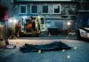 Nine Shootings. Nine Definitions. Zero Clarity. Police investigation at a crime scene with a covered body and evidence markers
