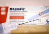 Ozempic injection pen with a droplet at the needle tip