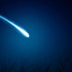 Baby Saturn Stuns Astronomers A bright comet streaking across a dark night sky filled with stars