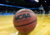 FBI Raid Upends College Hoops Star Close-up of NCAA basketball on court.