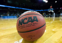 Close-up of NCAA basketball on court.
