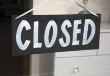 Corporate Axe Falls On DQ — Dozens Go Dark A black sign with the word 'CLOSED' painted in white letters