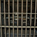 Florida’s Double Execution Shocks Liberals Empty, rusty barred jail cell with metal bunks.