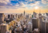 City skyline with skyscrapers at sunset.