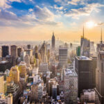Empire State Break-In: Love Stunt Turns Felony City skyline with skyscrapers at sunset.