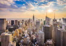Empire State Break-In: Love Stunt Turns Felony City skyline with skyscrapers at sunset.