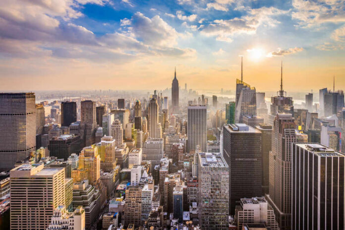 shutterstock_762344239 City skyline with skyscrapers at sunset.