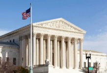 Supreme Showdown: AR-15 Bans On Trial U.S. Supreme Court building with American flag.