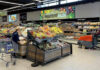 Parasite Panic Upends America’s Salad People shopping and cleaning inside an Aldi supermarket.