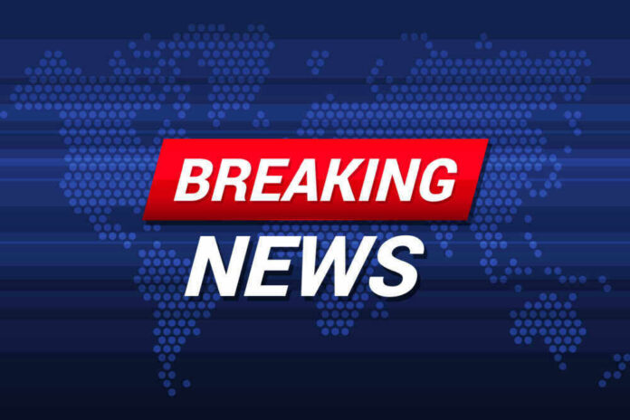 Breaking News text on world map background.