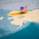 Alaska Fog, Eight Dead Map of Alaska with a small American flag