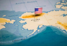 Alaska Fog, Eight Dead Map of Alaska with a small American flag
