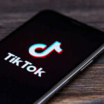 TikTok logo on smartphone screen.