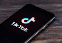 Supreme Snub Jolts Meta, TikTok TikTok logo on smartphone screen.