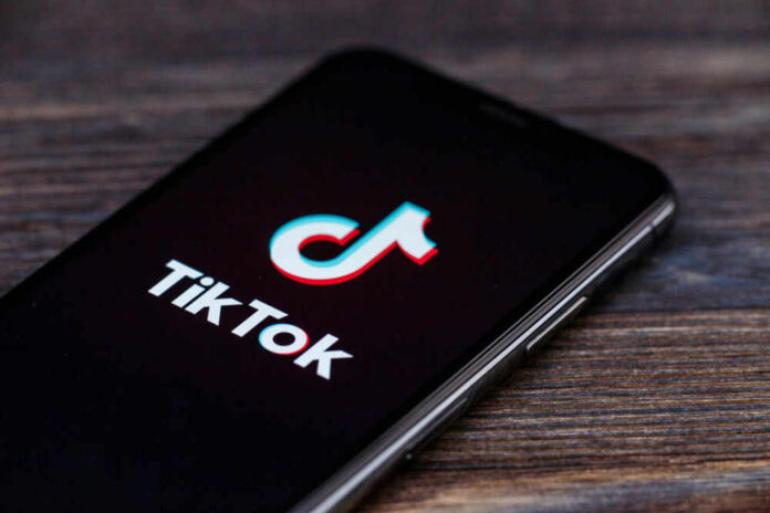 shutterstock_1451827259 TikTok logo on smartphone screen.