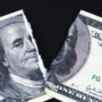 $1.8B Slush Fund Killed — Why Now? A torn hundred dollar bill featuring Benjamin Franklin