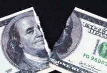 $1.8B Slush Fund Killed — Why Now? A torn hundred dollar bill featuring Benjamin Franklin