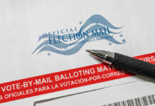 Voter Lists Or No Mail: USPS Line Vote-by-mail envelope with pen on top.
