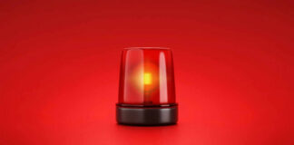 Red emergency light on red background