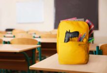 Teen Gunman Upends A Nation A yellow backpack with a gun partially visible in a classroom setting