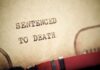 Shocking Verdict: Assad Condemned — But Where’s Justice? Close-up of a typewritten document stating 'SENTENCED TO DEATH'