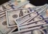 Cash Frenzy Hits City Streets Close-up of scattered hundred dollar bills
