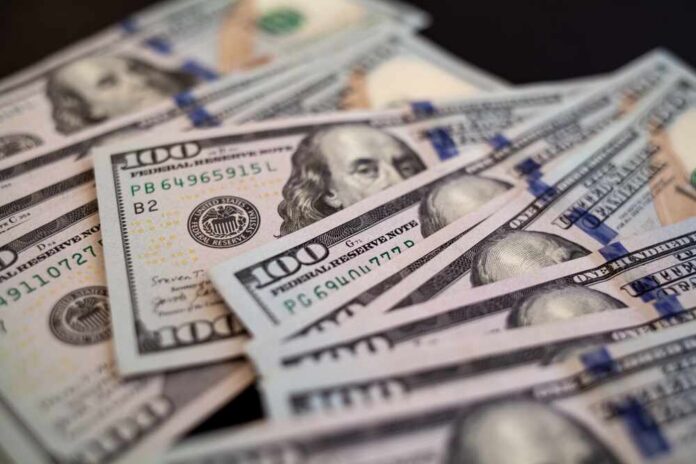 Pile,Of,One,Hundred,Us,Banknotes.,Background,With,Money,American Close-up of scattered hundred dollar bills