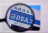 Closeup of DEA website through a magnifying glass.
