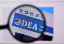 Closeup of DEA website through a magnifying glass.