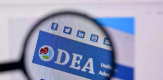 Closeup of DEA website through a magnifying glass.