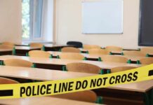 Empty classroom blocked by police tape