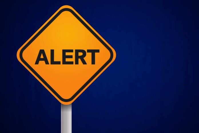 Yellow,Alert,Sign,With,Blue,Background Orange alert sign with the word 'ALERT' displayed prominently