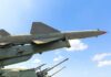 Patriot Crunch: NATO’s Quiet Panic Missile on a launcher against a blue sky