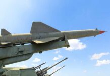 Missile on a launcher against a blue sky