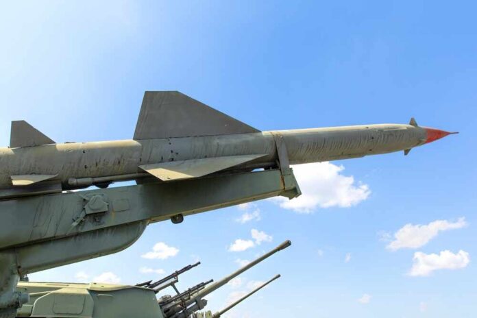 Missile on a launcher against a blue sky