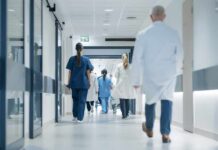 Hospital Mix-Up Paralyzes Patients Medical staff walking through a hospital corridor