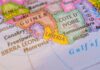 Third-Country Dumping Begins — Liberia Hit USCIS documents and a green card on a table