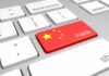 China Hackers Penetrated DOJ, Fed, Senate Keyboard key with China flag and hack label
