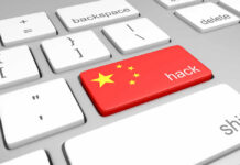 China Hackers Penetrated DOJ, Fed, Senate Keyboard key with China flag and hack label