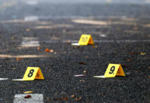 Yellow evidence markers labeled 8, 9, 10 on pavement.