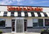 Steak ’n Shake’s Bold New Gambit Exterior view of a Steak 'n Shake restaurant with a striped awning