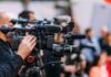 Deadly Candy Recall Hits Millions Video cameras on tripods at a media event